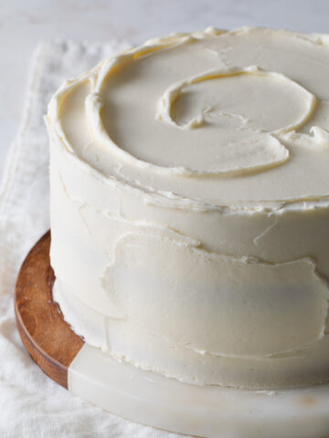Creamy white chocolate icing on an 8 inch cake