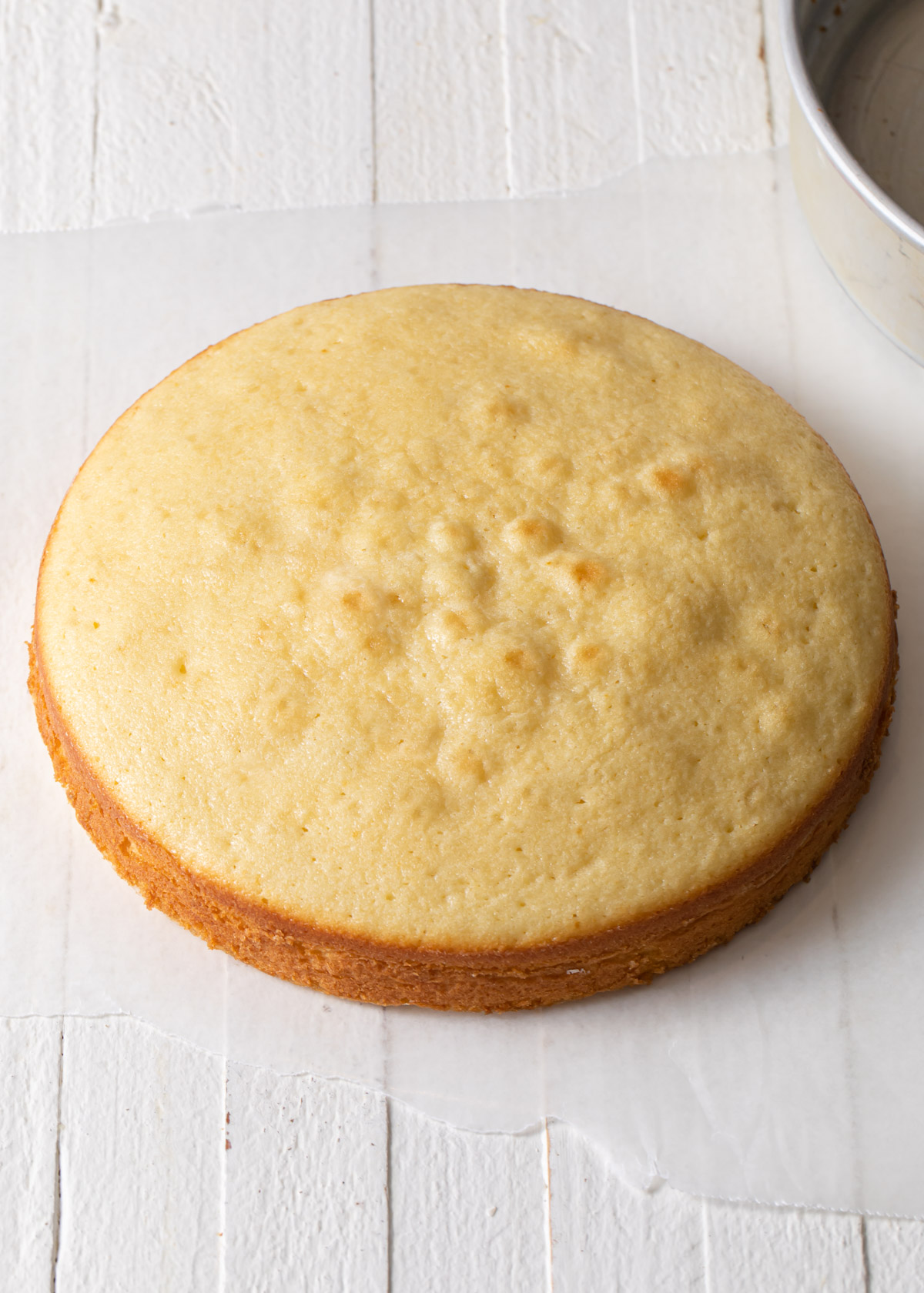 A baked single layer 8 inch yellow cake