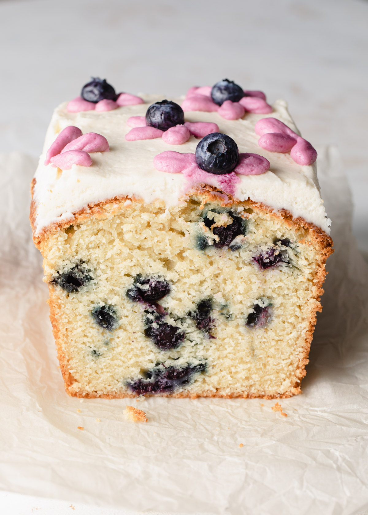 A close-up of a cross-section blueberry pound cake