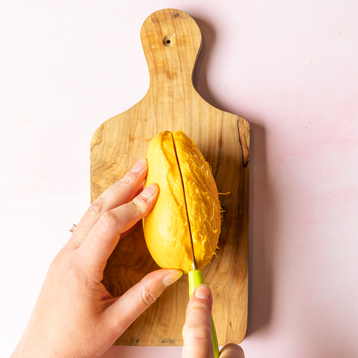 cutting a mango in half 