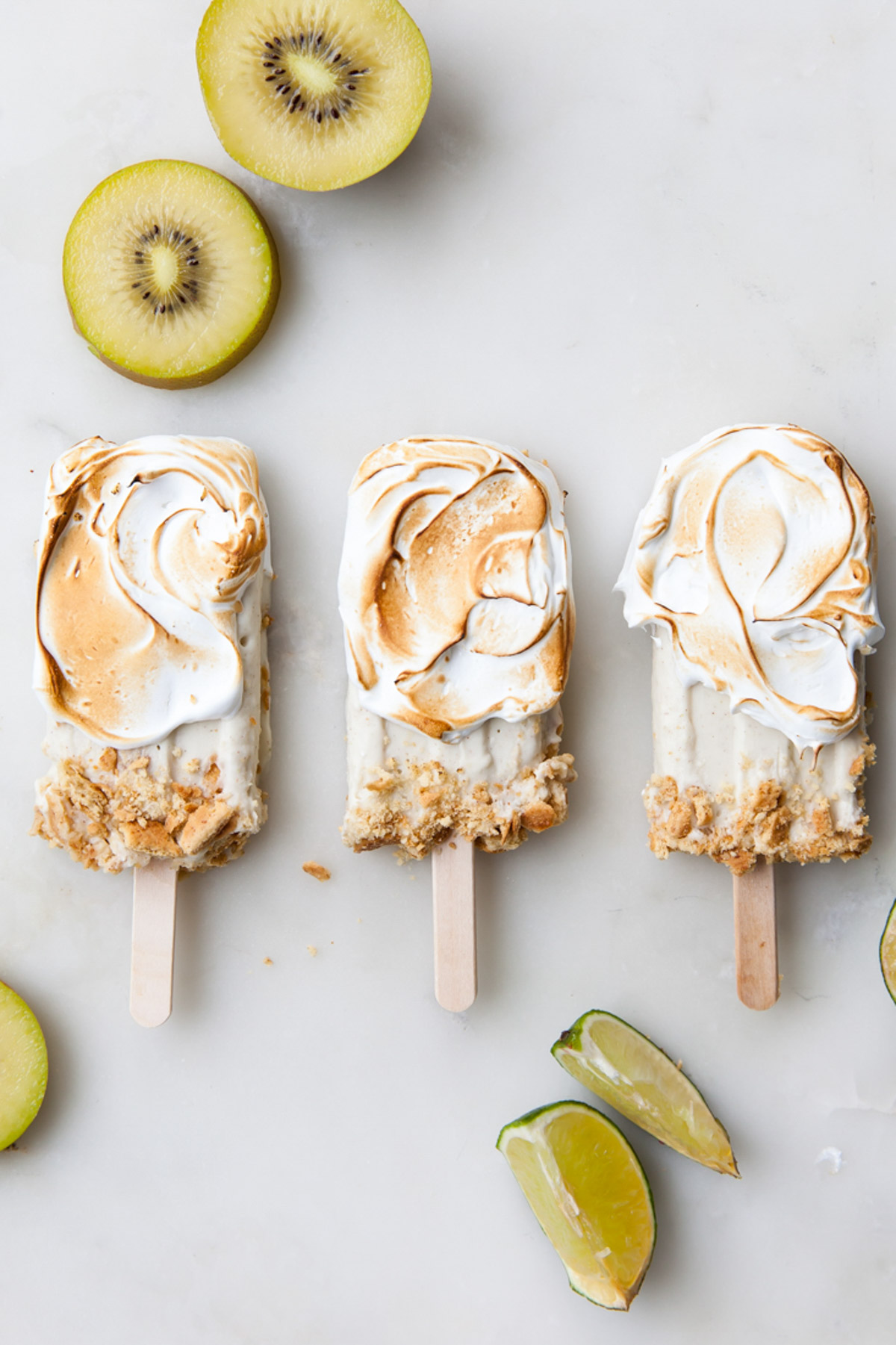 Kiwi limi popsicles with toasted meringue on the outside.