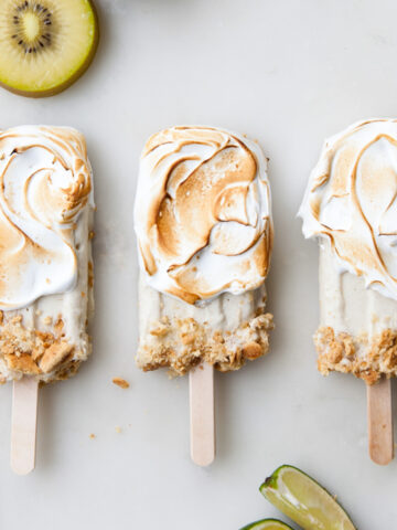 Kiwi limi popsicles with toasted meringue on the outside.