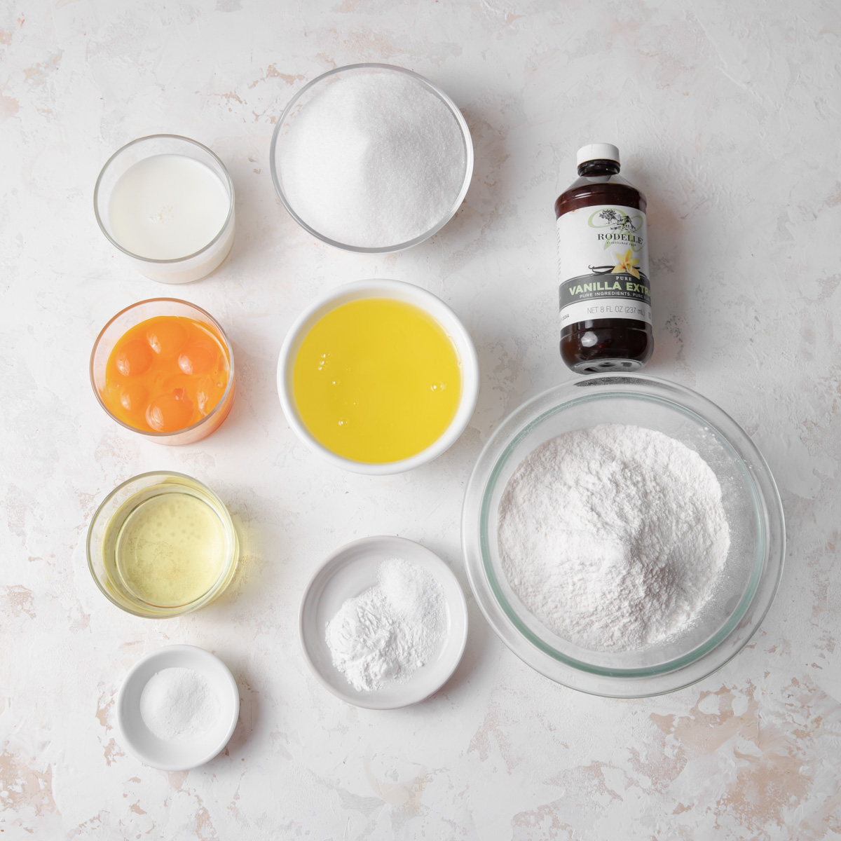 an overhead image of the ingredients used to make a vanilla chiffon cake