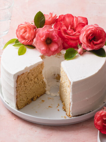 A beautiful chiffon cake with fresh roses on top