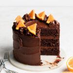 A three layer chocolate orange cake that's been sliced open