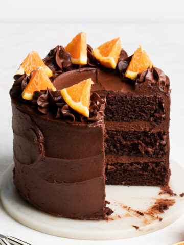 A three layer chocolate orange cake that's been sliced open
