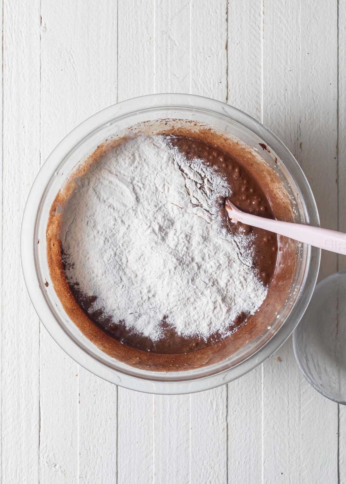 Adding flour to cocoa brownie batter