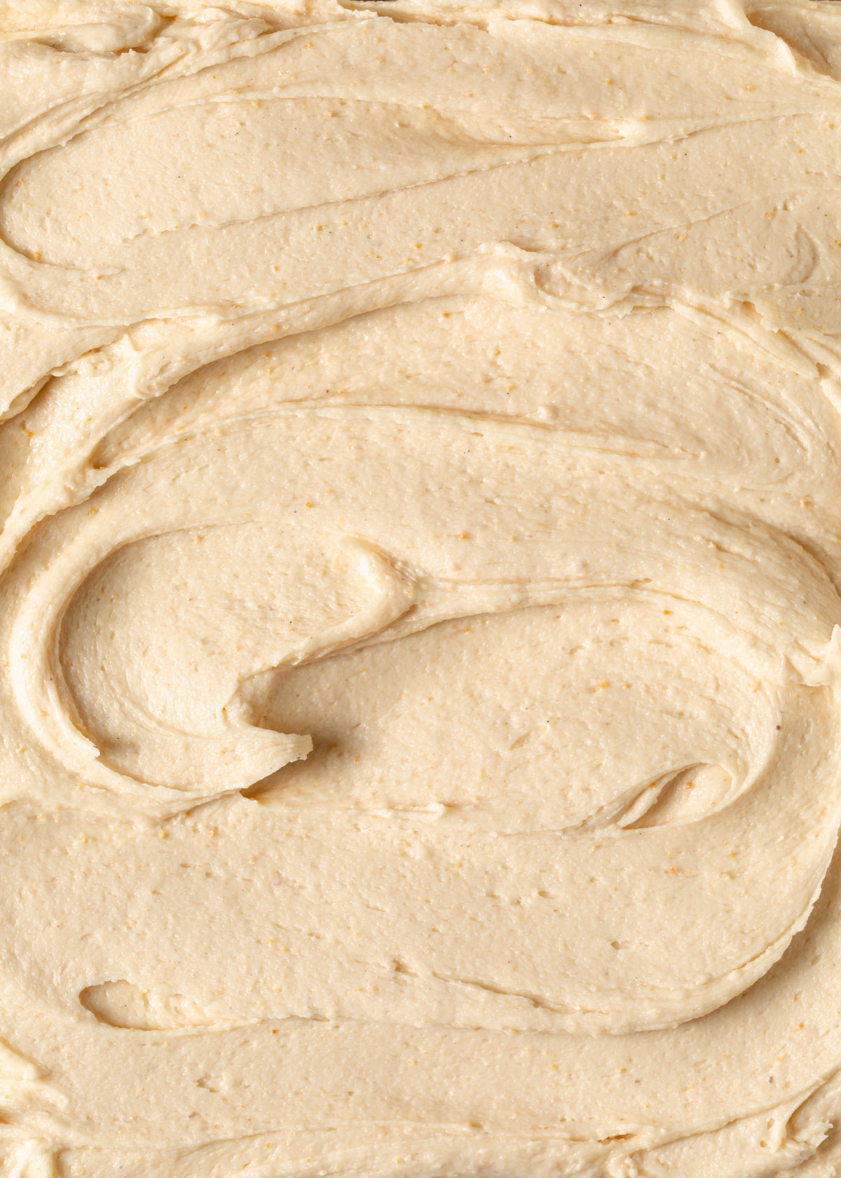 Swirls of creamy peanut butter cream cheese frosting