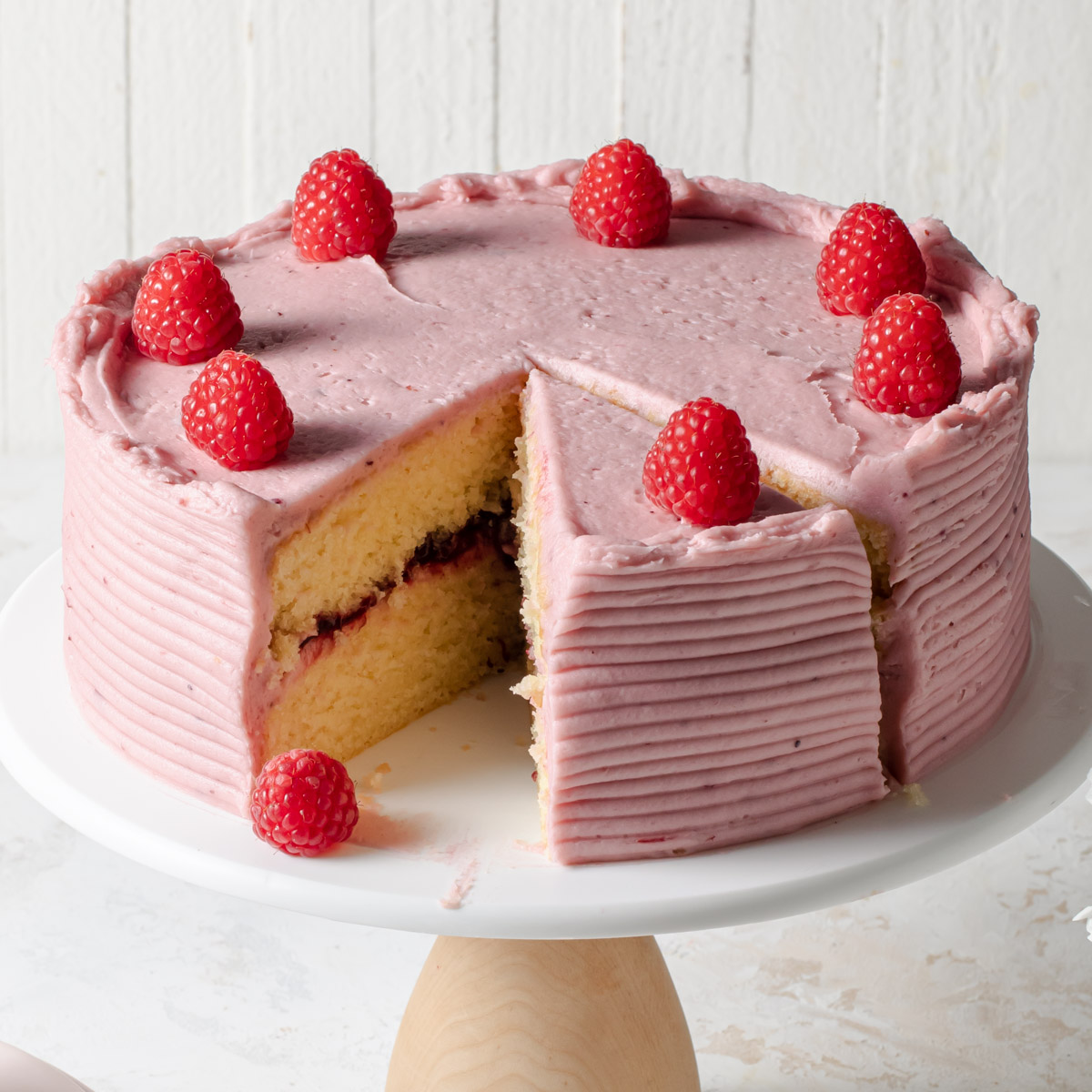 A two-layer almond cake with raspberry filling and frosting.