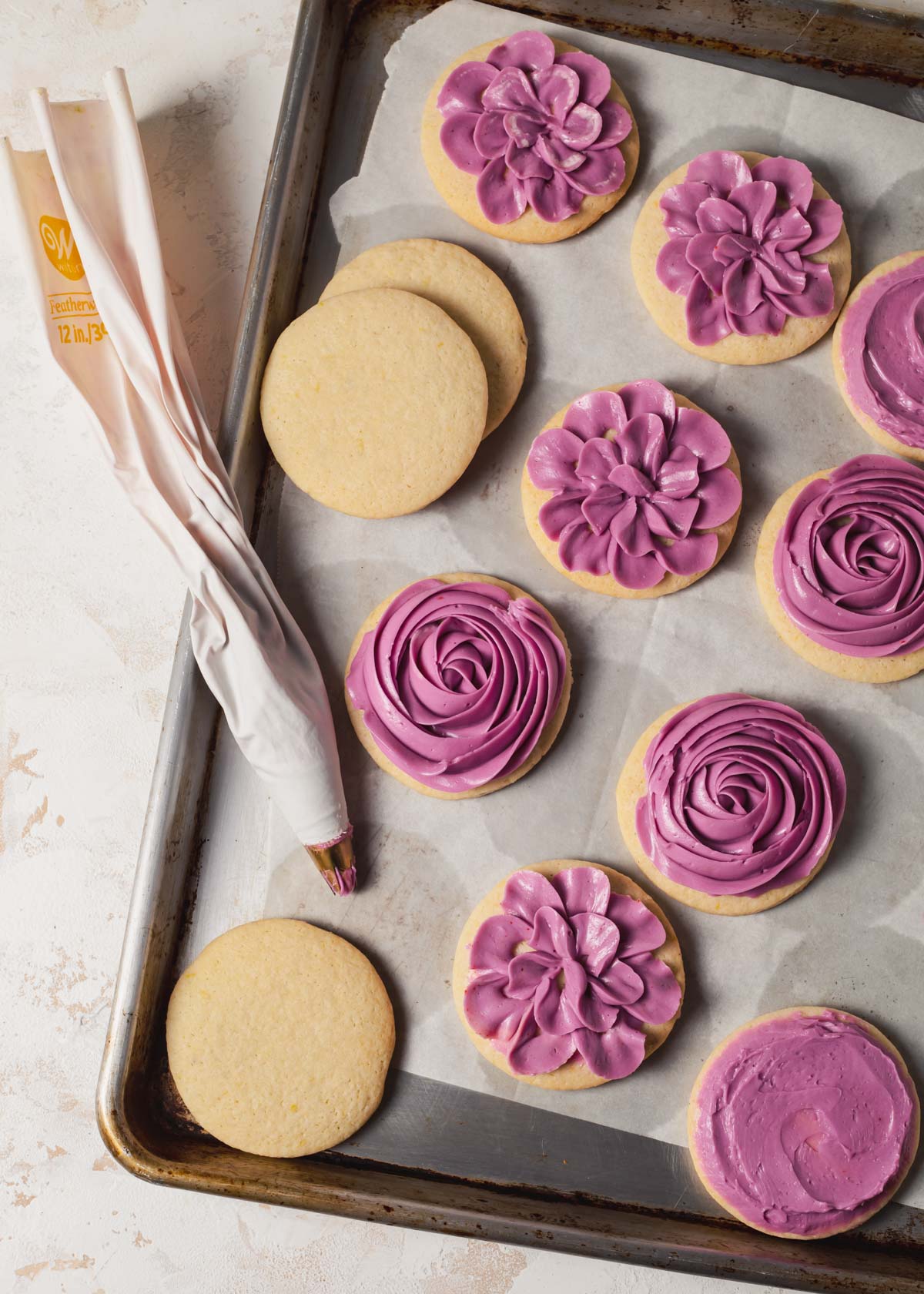 Piped buttercream on sugar cookies