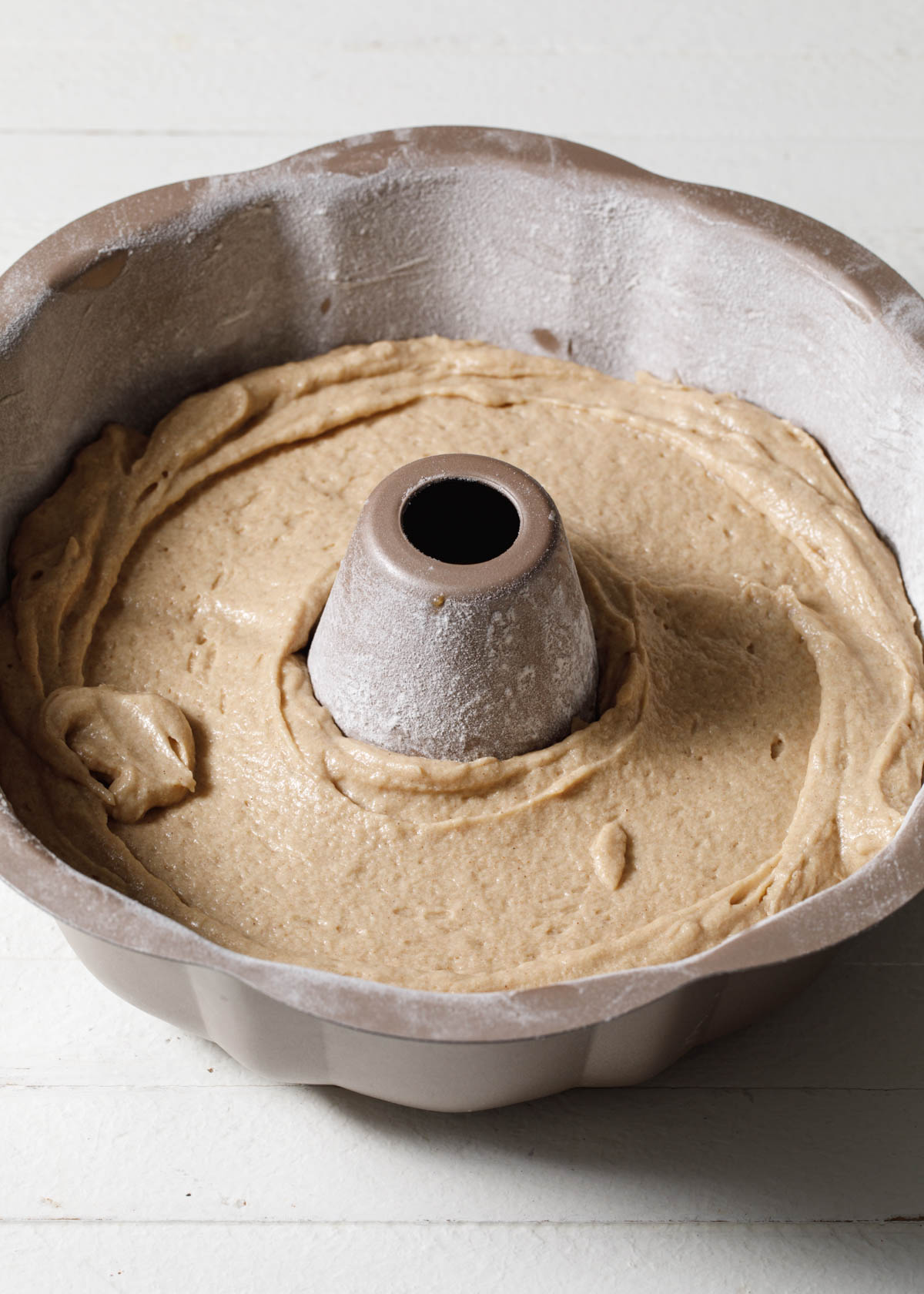 Cake batter poured into a bundt pan