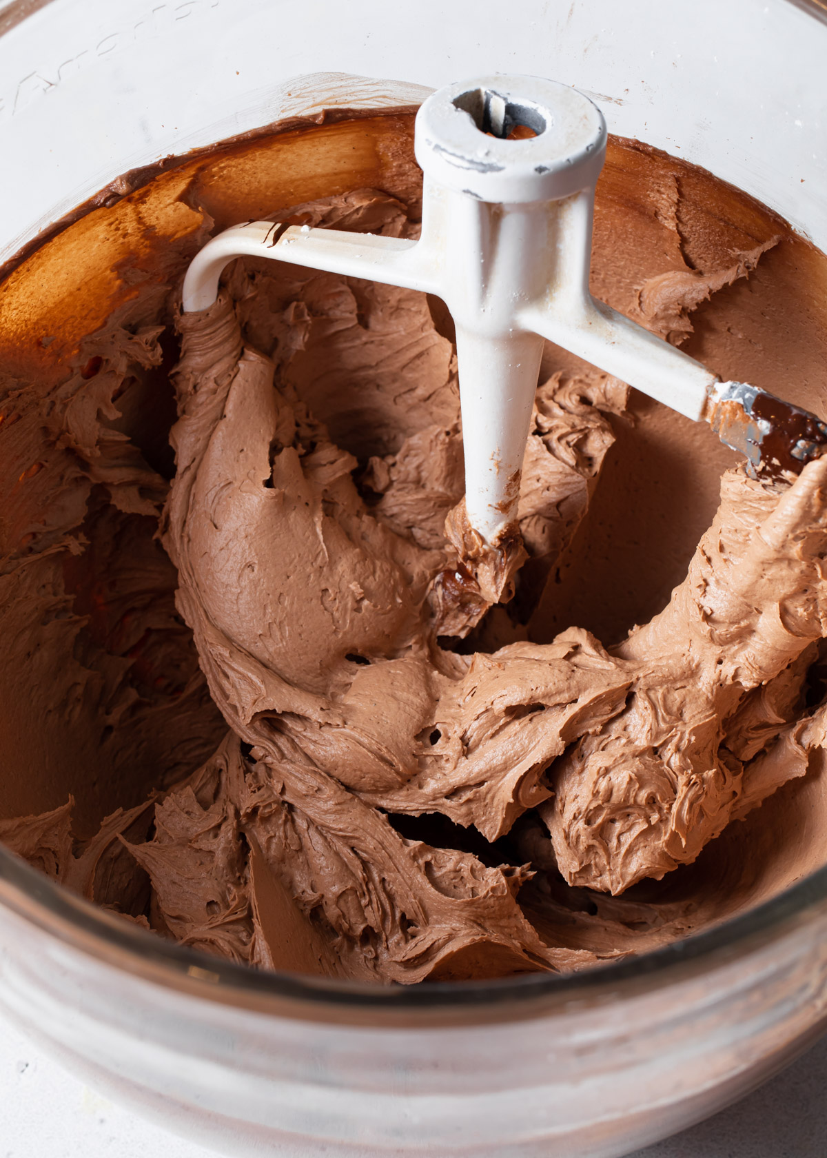 A mixing bowl of whipped chocolate buttercream