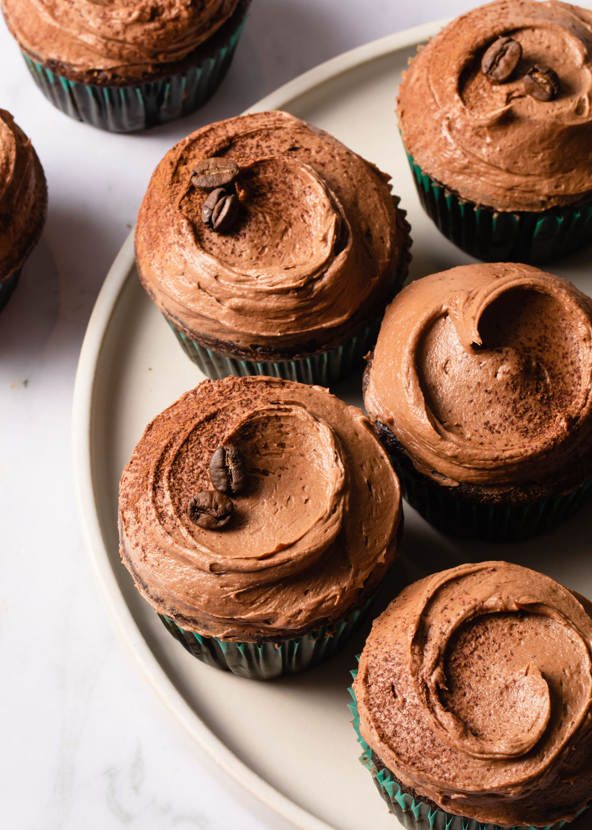 Swirls of mocha frosting on cupcakes