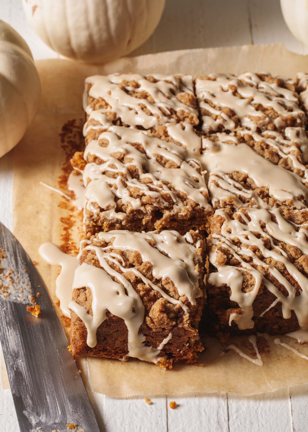 A sliced and glaze pumpkin coffee cake