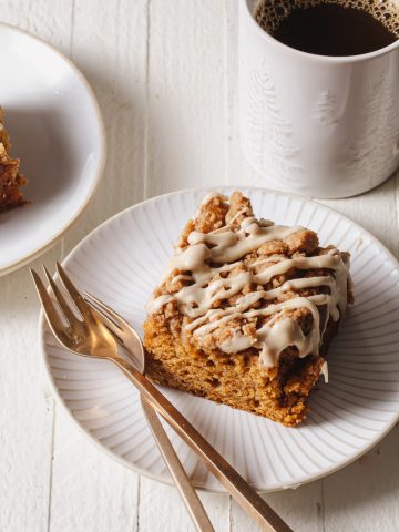 A slice on pumpkin coffee cake on a plate
