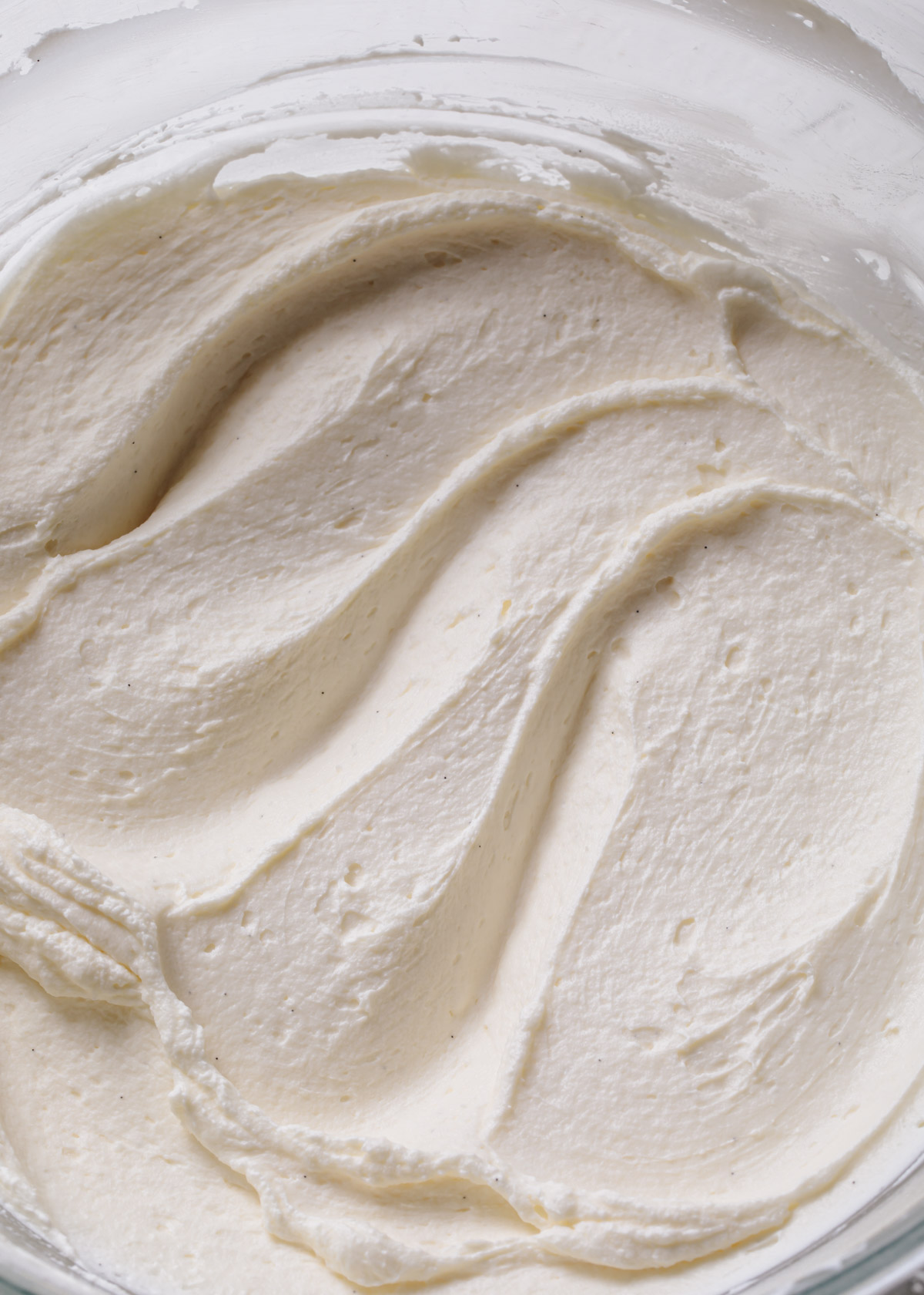 Smooth white chocolate ganache in a bowl