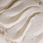 Smooth white chocolate ganache in a bowl