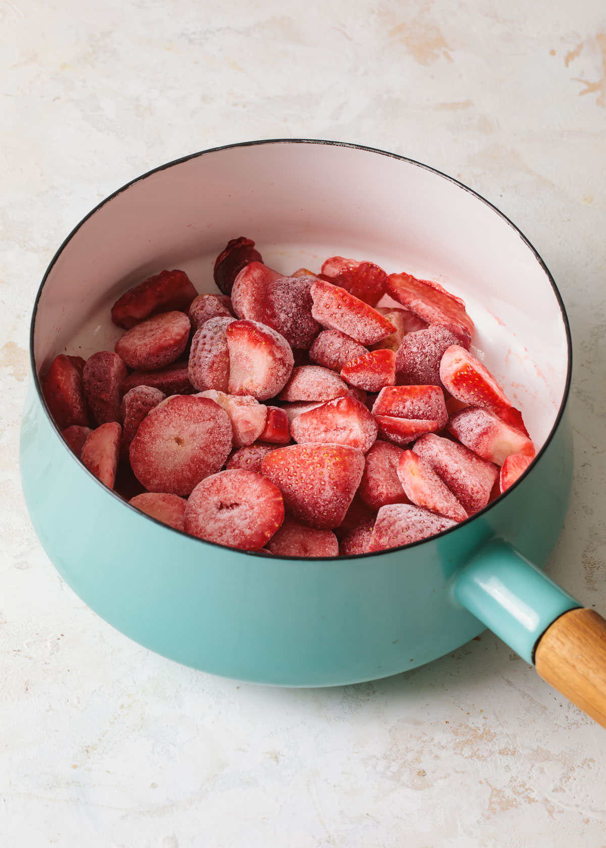 A pan of sliced strawberries before cooking.