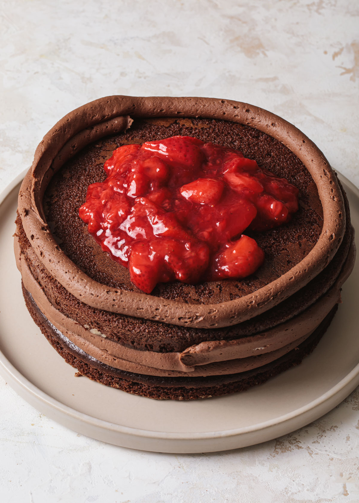 Strawberry cake filling inside a chocolate cake
