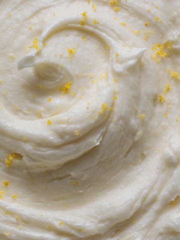 a bowl of swirly lemon cream cheese frosting