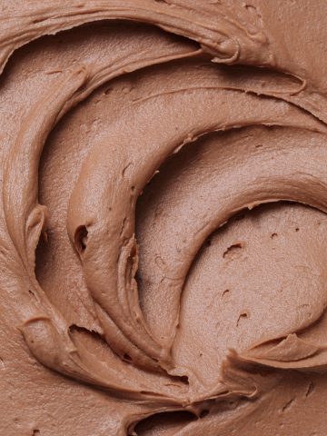 Close up of milk chocolate buttercream frosting swirls