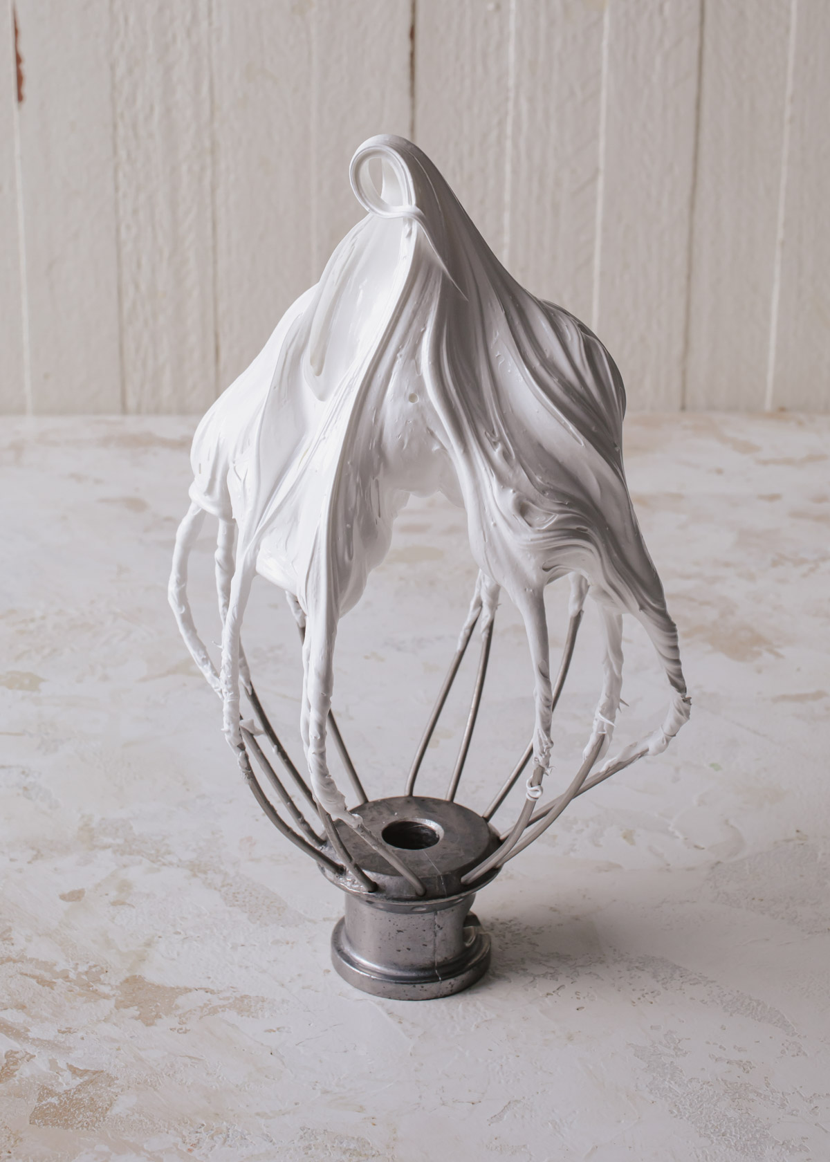 Whipped meringue on a whisk