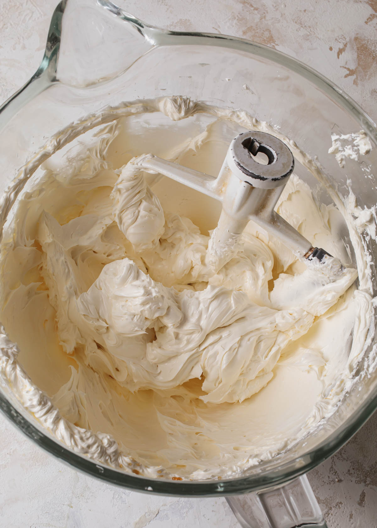 a mixing bowl of creamy Swiss meringue buttercream